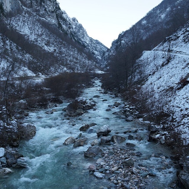 Icy river running through a snowy Rugova gorge